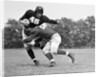 1940s Football Player Being Tackled by Anonymous