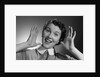 1950s Happy Woman Holding Hands Up Beside Her Head by Anonymous