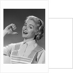 1950s 1960s Woman Housewfe In Apron Proudly Pointing At Herself With Thumb by Anonymous