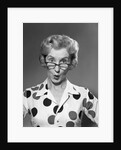 1950s 1960s Portrait Woman Polka Dot Dress Looking Over Eyeglasses by Anonymous