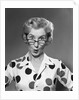 1950s 1960s Portrait Woman Polka Dot Dress Looking Over Eyeglasses by Anonymous