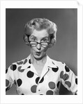 1950s 1960s Portrait Woman Polka Dot Dress Looking Over Eyeglasses by Anonymous