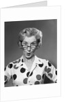 1950s 1960s Portrait Woman Polka Dot Dress Looking Over Eyeglasses by Anonymous