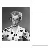 1950s 1960s Portrait Woman Polka Dot Dress Looking Over Eyeglasses by Anonymous