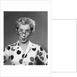 1950s 1960s Portrait Woman Polka Dot Dress Looking Over Eyeglasses by Anonymous