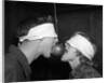 1950s Blindfolded Couple Trying To Eat An Apple Hanging In Air From A String Inside by Anonymous