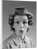 1960s Portrait Woman With Hair In Rollers Eyes Wide With Suprise by Anonymous