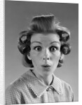 1960s Portrait Woman With Hair In Rollers Eyes Wide With Suprise by Anonymous