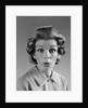 1960s Portrait Woman With Hair In Rollers Eyes Wide With Suprise by Anonymous