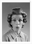 1960s Portrait Woman With Hair In Rollers Eyes Wide With Suprise by Anonymous
