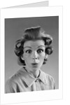 1960s Portrait Woman With Hair In Rollers Eyes Wide With Suprise by Anonymous