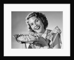 1950s Woman Presenting Holding Freshly Baked Pie by Anonymous