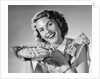 1950s Woman Presenting Holding Freshly Baked Pie by Anonymous