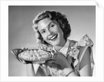 1950s Woman Presenting Holding Freshly Baked Pie by Anonymous