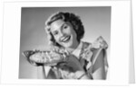 1950s Woman Presenting Holding Freshly Baked Pie by Anonymous