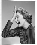 1950s Woman Hitting Forehead With Heel Of Hand by Anonymous