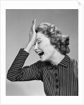 1950s Woman Hitting Forehead With Heel Of Hand by Anonymous