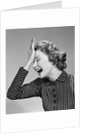 1950s Woman Hitting Forehead With Heel Of Hand by Anonymous
