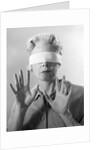 1960s Elderly Woman Wearing Blindfold Holding Up Her Hands by Anonymous