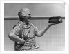 1930s 1940s Grandmother In Apron Admiring Loaf Of Freshly Baked Bread by Anonymous