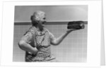 1930s 1940s Grandmother In Apron Admiring Loaf Of Freshly Baked Bread by Anonymous