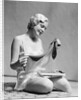 1930s Woman In Silk Teddy Lingerie Opening A Box Of Hosiery by Anonymous