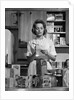 1960s Woman Housewife In Kitchen Checking Grocery Food Shopping List by Anonymous
