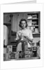 1960s Woman Housewife In Kitchen Checking Grocery Food Shopping List by Anonymous