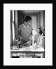 1920s 1930s Mother With Mixing Bowl In Kitchen With Daughter by Anonymous