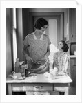 1920s 1930s Mother With Mixing Bowl In Kitchen With Daughter by Anonymous