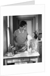 1920s 1930s Mother With Mixing Bowl In Kitchen With Daughter by Anonymous