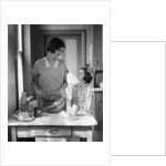 1920s 1930s Mother With Mixing Bowl In Kitchen With Daughter by Anonymous