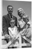 1950s 1960s Portrait Family Father Mother Son Daughter Behind White Fence Outdoor by Anonymous