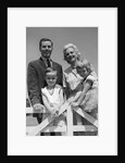 1950s 1960s Portrait Family Father Mother Son Daughter Behind White Fence Outdoor by Anonymous