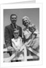 1950s 1960s Portrait Family Father Mother Son Daughter Behind White Fence Outdoor by Anonymous