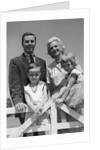 1950s 1960s Portrait Family Father Mother Son Daughter Behind White Fence Outdoor by Anonymous