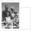 1950s 1960s Portrait Family Father Mother Son Daughter Behind White Fence Outdoor by Anonymous
