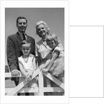 1950s 1960s Portrait Family Father Mother Son Daughter Behind White Fence Outdoor by Anonymous