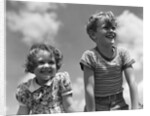 1930s Boy And Girl Bright Summer Day Sky With Clouds by Anonymous