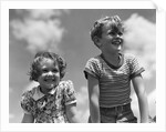 1930s Boy And Girl Bright Summer Day Sky With Clouds by Anonymous