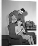 1940s Teen Couple Boy With Hand Over Girl Eyes Surprising Her With Box Of Valentines Day Candy by Anonymous