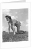 1940s Young Teen Woman Kneeling In Grass In Track Race Ready Starting Position by Anonymous