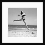 1950s Woman In Bikini Running And Jumping On The Beach Smiling by Anonymous