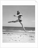 1950s Woman In Bikini Running And Jumping On The Beach Smiling by Anonymous