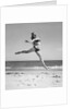 1950s Woman In Bikini Running And Jumping On The Beach Smiling by Anonymous
