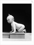 1930s 1940s Naked Baby Crawling On Wooden Box by Anonymous
