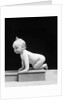 1930s 1940s Naked Baby Crawling On Wooden Box by Anonymous