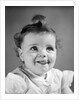 1940s Baby Girl Sticking Out Her Tongue by Anonymous