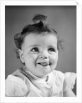 1940s Baby Girl Sticking Out Her Tongue by Anonymous