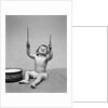 1940s Baby In Diaper With Drum Holding Up Drumsticks by Anonymous
